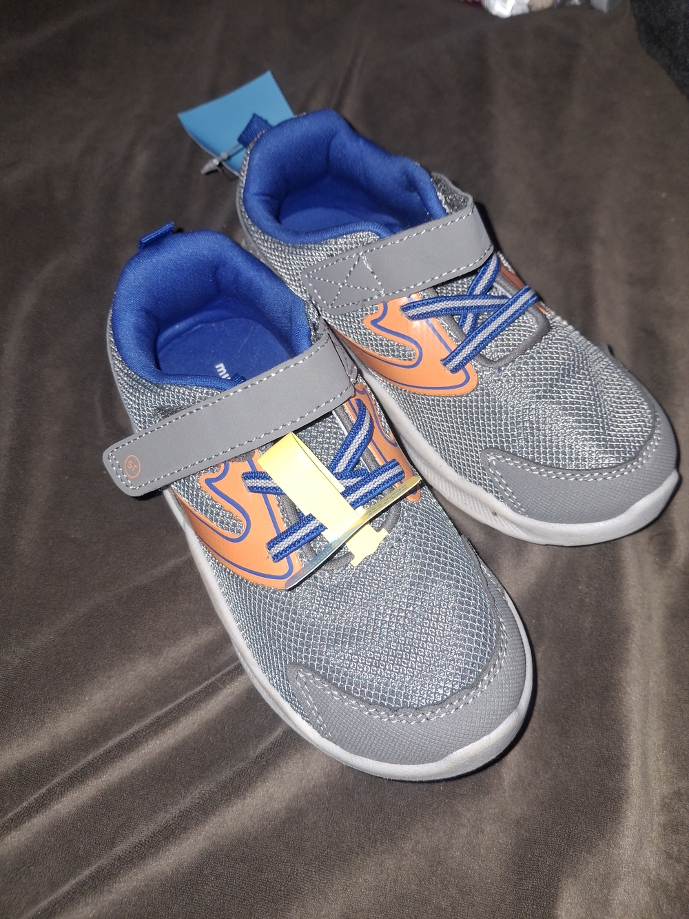 Munchkin Grey Sneakers with Orange Accents and Blue Lining